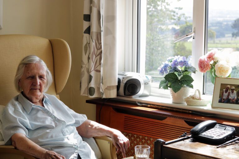Resident at Roselands Residential Care Home Seated in Her Room