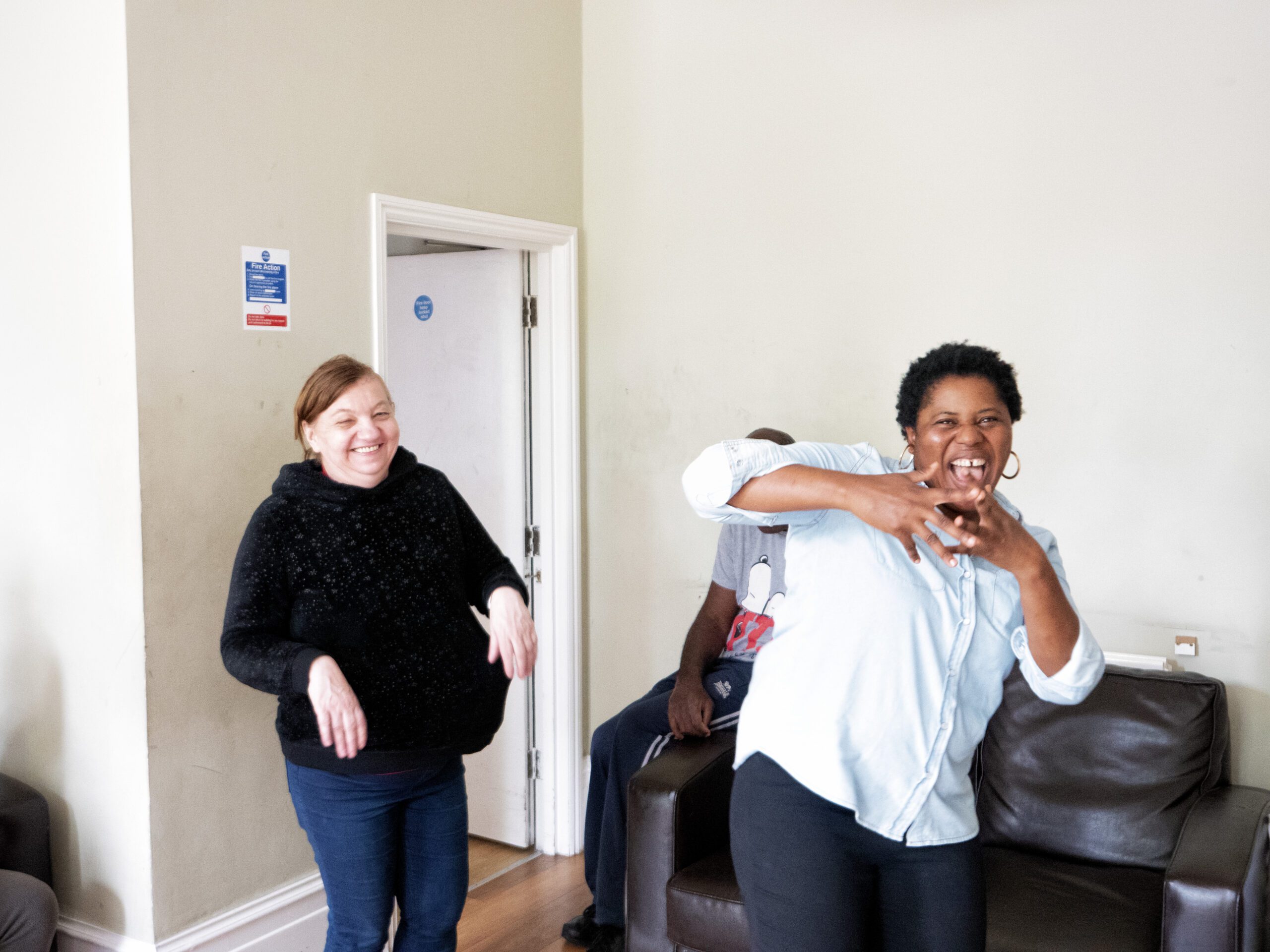 Care Worker at M Power Learning Disability Care Home in Catford Engaging with Resident